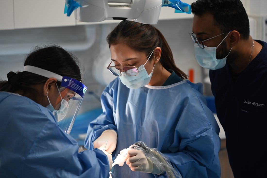 ImplanTalk clinicians focused during implant surgery